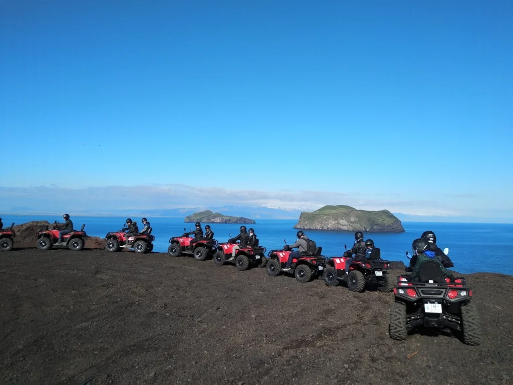 A convoy of ATVs overlooking the surrounding islands