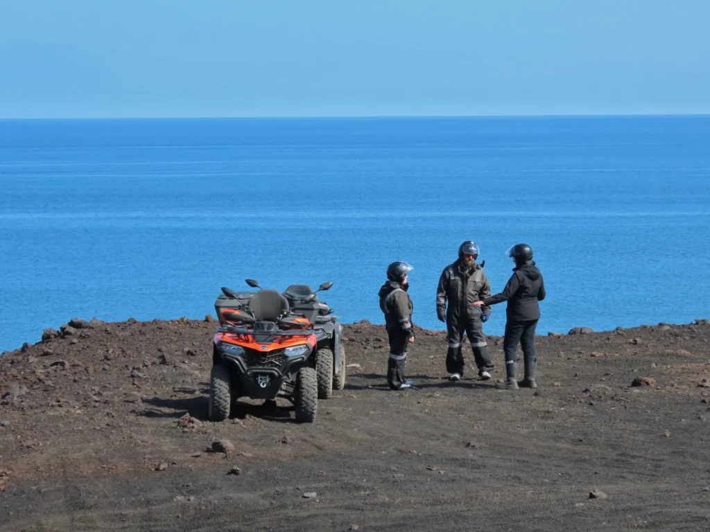 A local guide sharing stories beside the Atlantic
