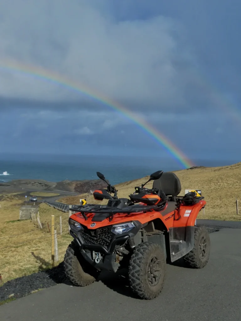 ATV beneath a rainbow on the island