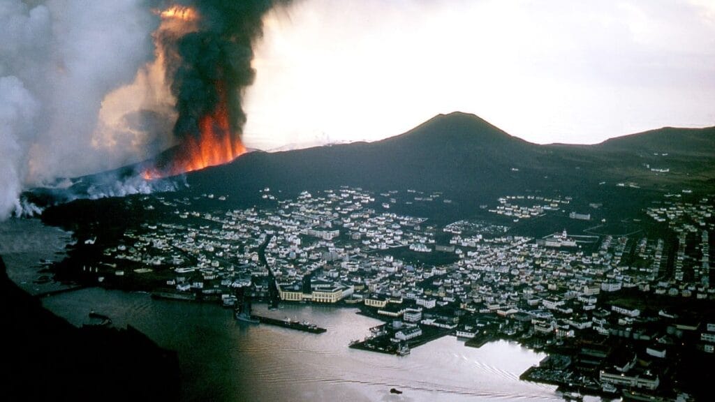 The 1973 Eldfell eruption threatens the town of Vestmannaeyjar.