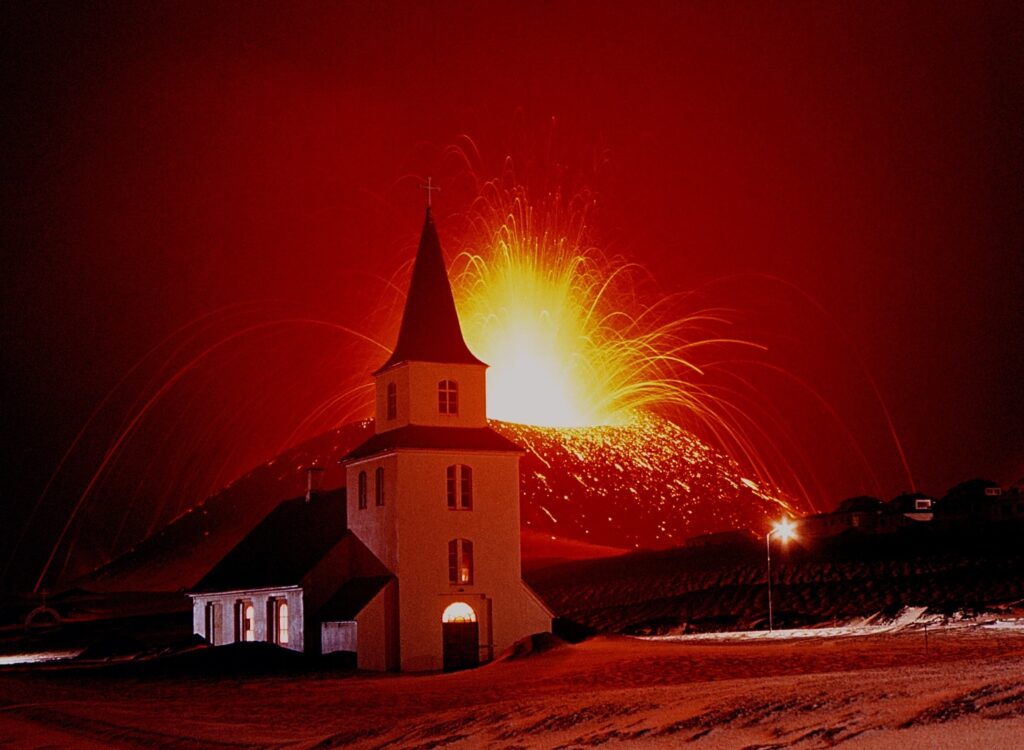 Spectacular lava fountains erupt behind Landakirkja church in 1973.