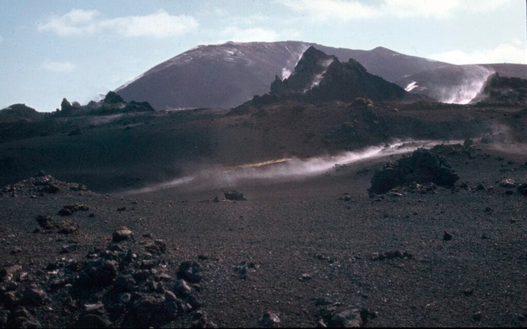 Steam rises from the newly formed lava fields during the 1973 eruption.